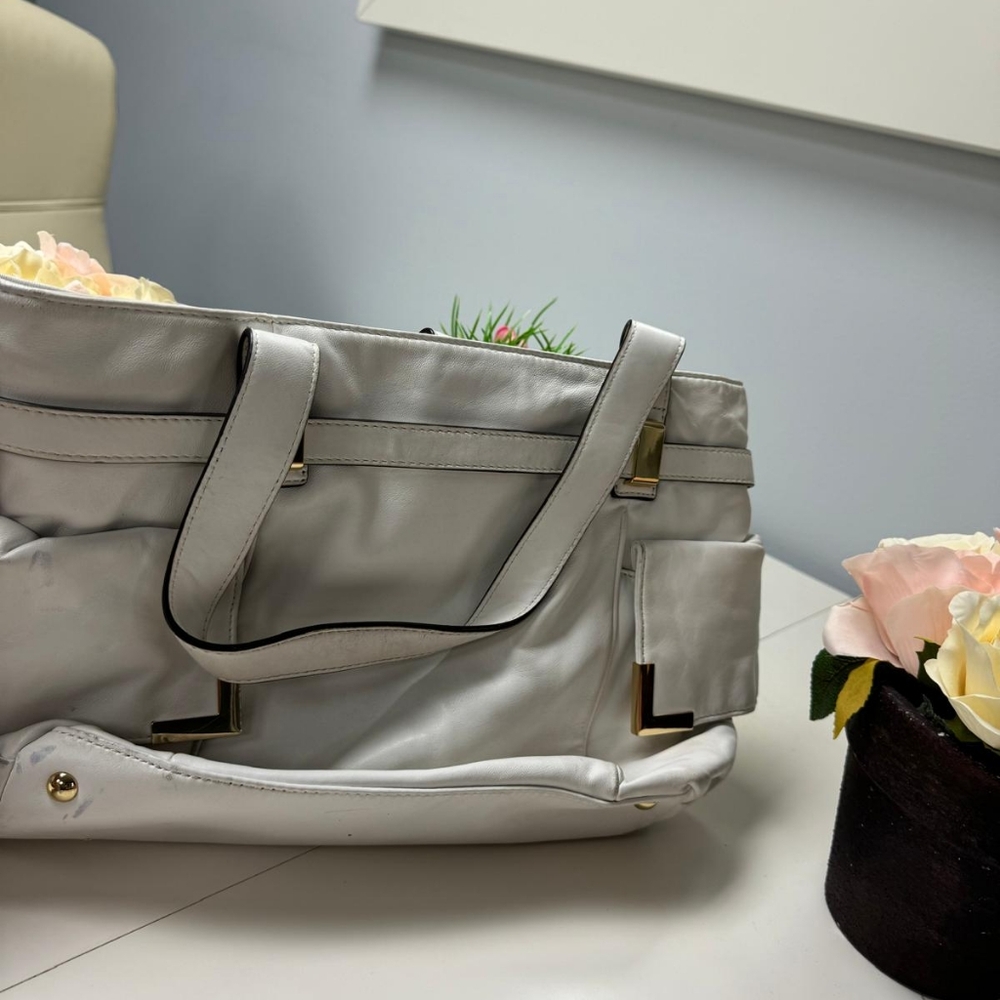 Michael Kors Bag Lambskin, two scuffed marks on the bottom.